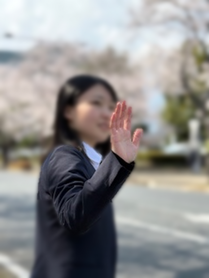 手を振るハンドサイン